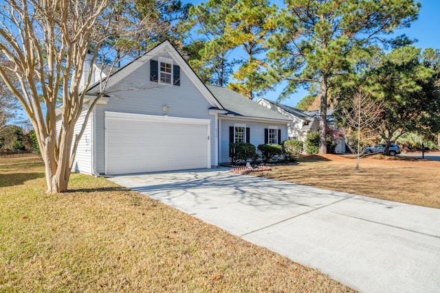 view of front facade with a garage and a front lawn