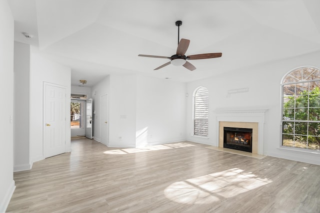 unfurnished living room with light hardwood / wood-style flooring and ceiling fan