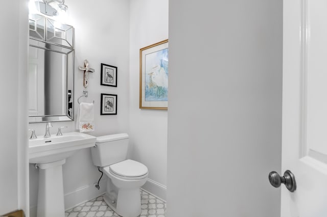 bathroom with tile floors and toilet