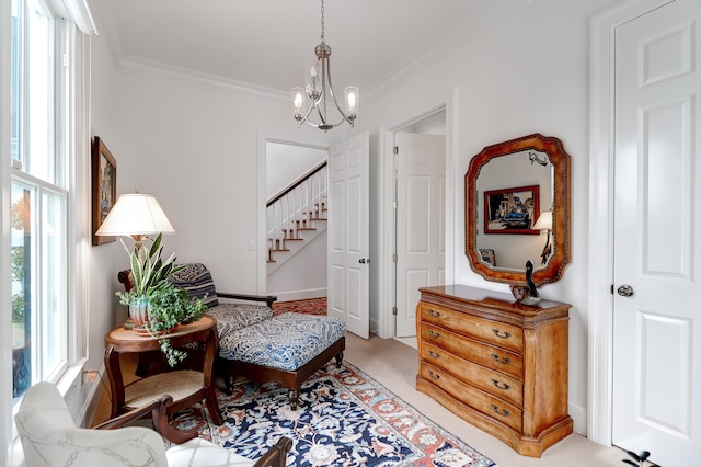 sitting room featuring an inviting chandelier, crown molding, and light carpet