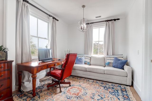 office area featuring a notable chandelier