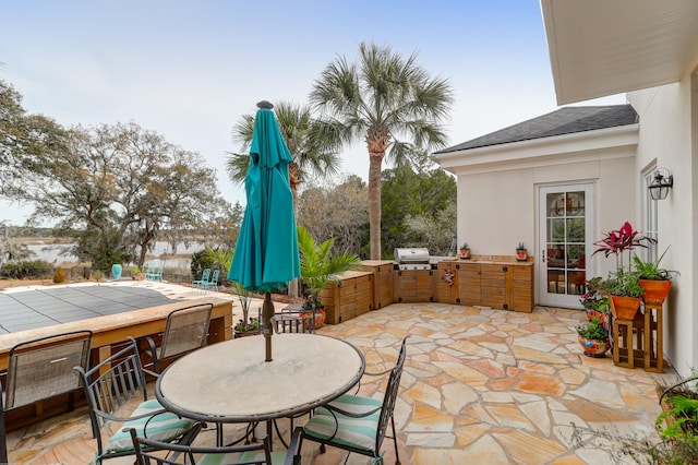 view of patio featuring exterior kitchen and area for grilling