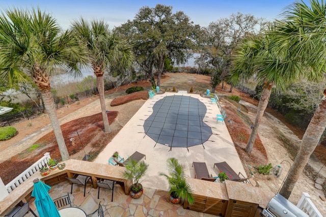 view of swimming pool with a patio