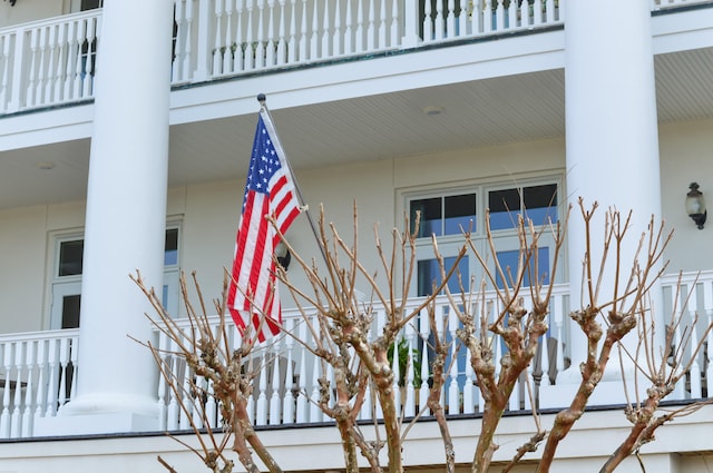 view of side of home featuring a balcony