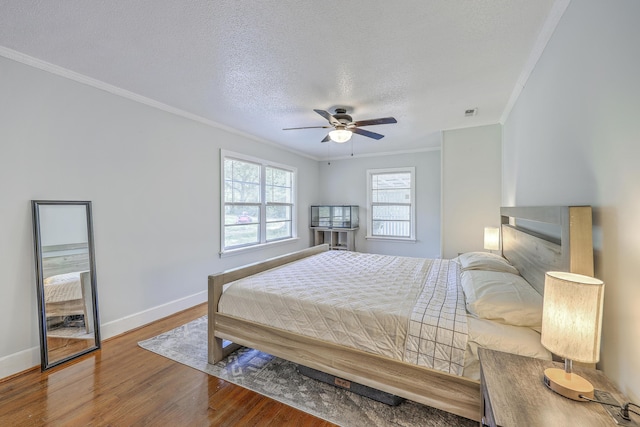 1314 Cooper Store Rd, Moncks Corner, SC 29461 - bedroom with ornamental molding, wood finished floors, baseboards, a textured ceiling, and a ceiling fan