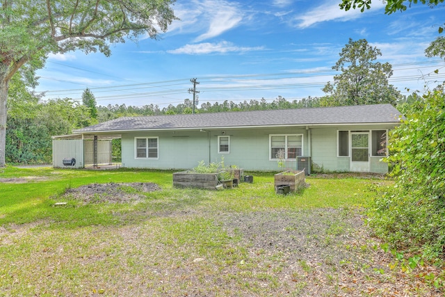 1314 Cooper Store Rd, Moncks Corner, SC 29461 - back of house featuring concrete block siding, a yard, a garden, a shingled roof, and central AC unit
