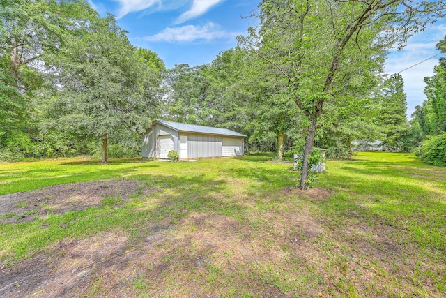 1314 Cooper Store Rd, Moncks Corner, SC 29461 - view of green lawn featuring an outdoor structure and a detached garage