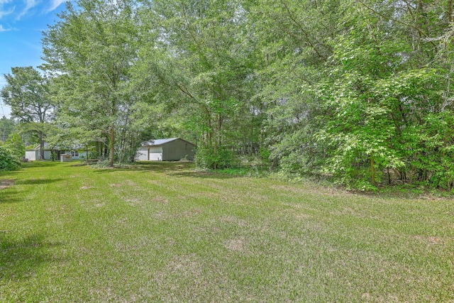 1314 Cooper Store Rd, Moncks Corner, SC 29461 - view of grassy yard with a pole building and an outbuilding