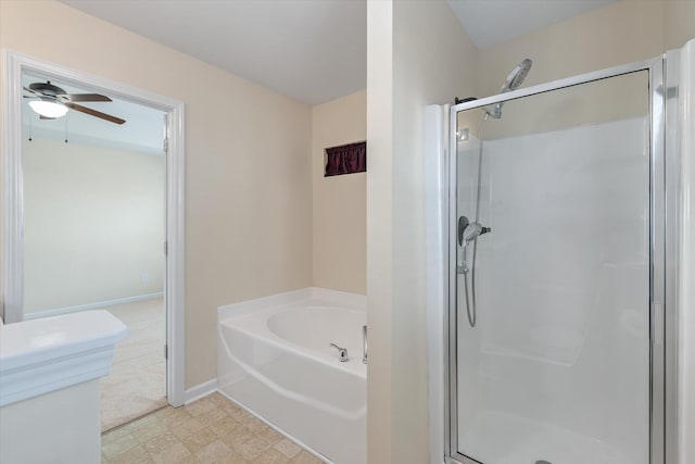 bathroom featuring a garden tub, a ceiling fan, baseboards, tile patterned floors, and a stall shower