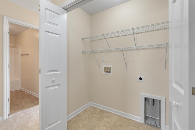 clothes washing area featuring baseboards, laundry area, washer hookup, and hookup for an electric dryer