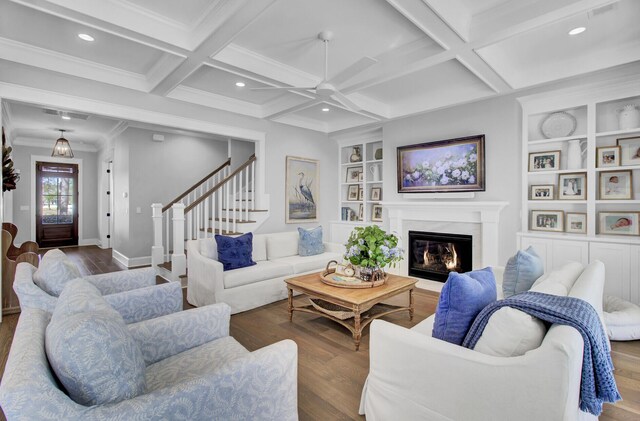 1098 Reserve Ln, Awendaw, SC 29429 - living room with ceiling fan, wood finished floors, coffered ceiling, a premium fireplace, and built in features