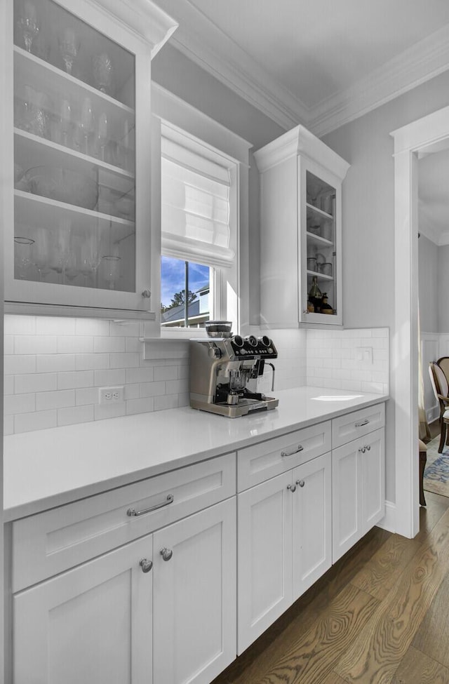 1098 Reserve Ln, Awendaw, SC 29429 - bar area with dark wood-type flooring, crown molding, and backsplash
