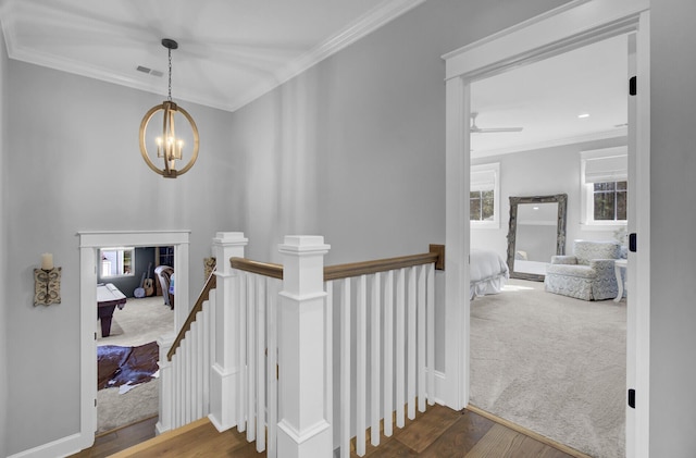 1098 Reserve Ln, Awendaw, SC 29429 - stairway with a chandelier, plenty of natural light, crown molding, wood finished floors, and carpet