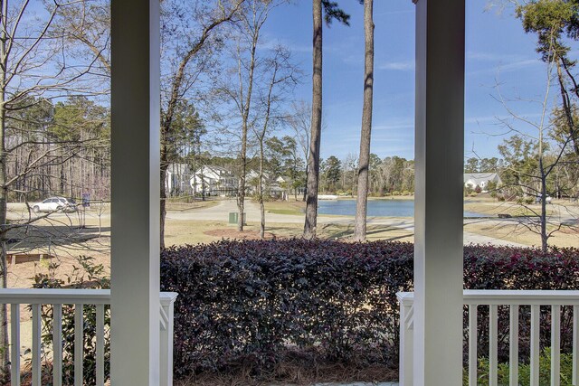 1098 Reserve Ln, Awendaw, SC 29429 - view of yard with a water view and covered porch