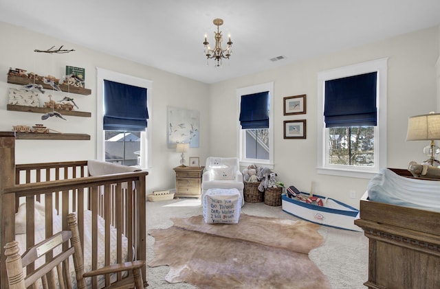 1098 Reserve Ln, Awendaw, SC 29429 - carpeted bedroom with a chandelier and a nursery area