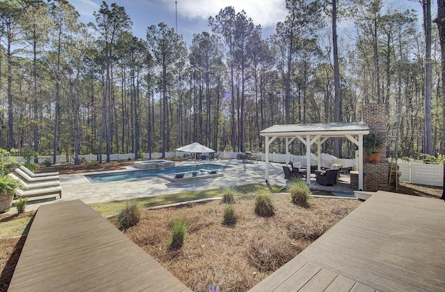 1098 Reserve Ln, Awendaw, SC 29429 - fenced backyard featuring a gazebo, an outdoor living space, a patio area, a pool with connected hot tub, and a wooded view
