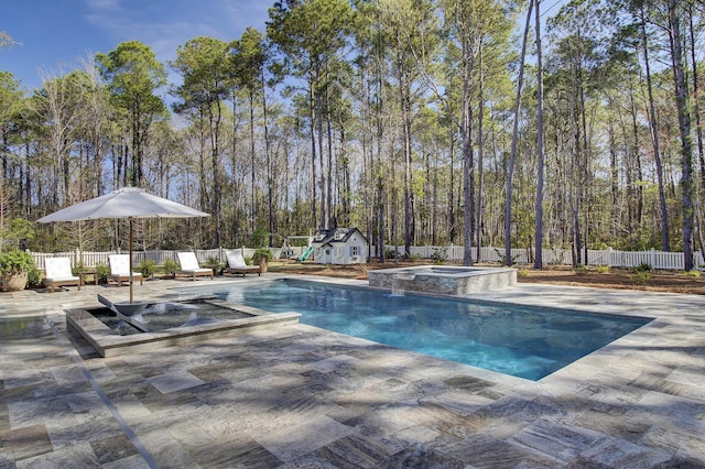 1098 Reserve Ln, Awendaw, SC 29429 - view of swimming pool featuring a pool with connected hot tub, a fenced backyard, an outdoor structure, and a patio area
