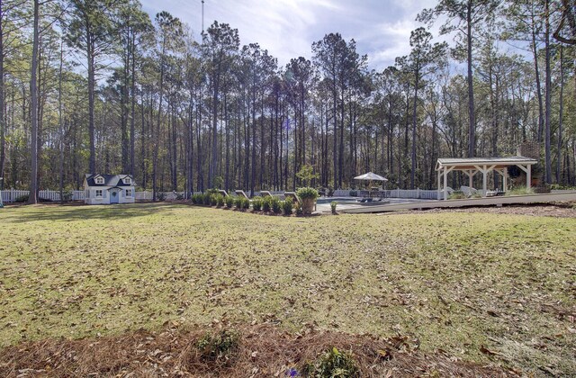 1098 Reserve Ln, Awendaw, SC 29429 - view of yard featuring a gazebo, a storage shed, and a wooded view