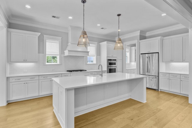 1098 Reserve Ln, Awendaw, SC 29429 - kitchen with appliances with stainless steel finishes, light countertops, white cabinets, light wood-style floors, and recessed lighting