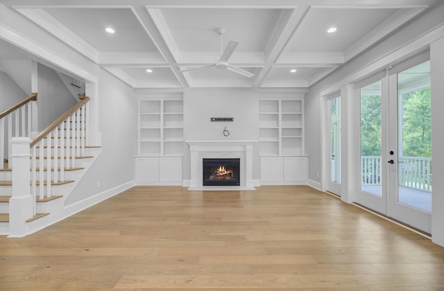 1098 Reserve Ln, Awendaw, SC 29429 - unfurnished living room with a ceiling fan, light wood-type flooring, built in shelves, recessed lighting, and stairs