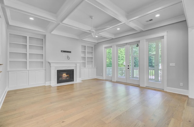 1098 Reserve Ln, Awendaw, SC 29429 - unfurnished living room with ceiling fan, a fireplace, light wood finished floors, french doors, and beam ceiling