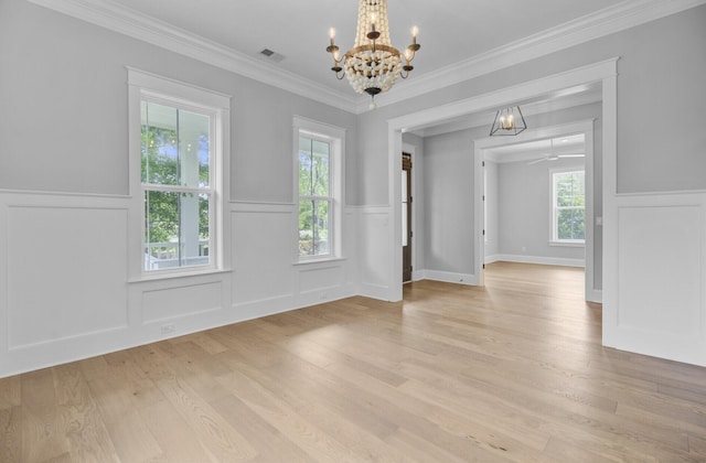 1098 Reserve Ln, Awendaw, SC 29429 - unfurnished room featuring a chandelier, a wainscoted wall, light wood-type flooring, a decorative wall, and crown molding