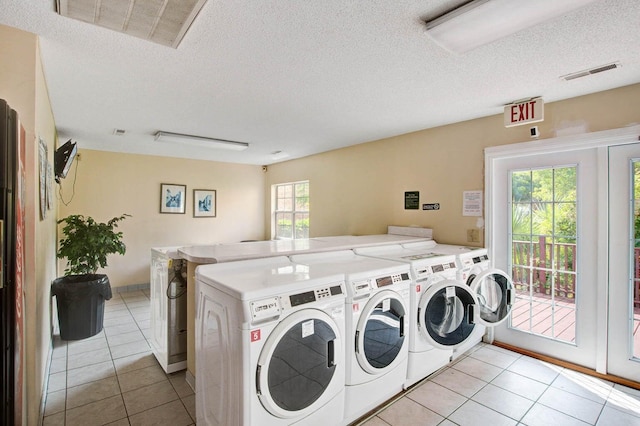 107 Hickory Ln Unit C, Ladson, SC 29456 - community laundry room with washer and dryer, a textured ceiling, and light tile patterned floors