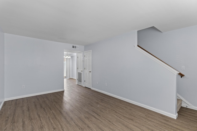 107 Hickory Ln Unit C, Ladson, SC 29456 - unfurnished living room featuring stairway, wood finished floors, and a chandelier