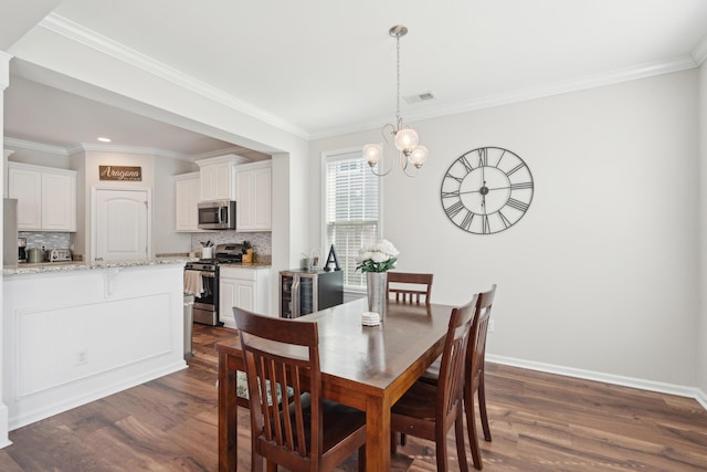 dining area with visible vents, dark wood finished floors, baseboards, and an inviting chandelier