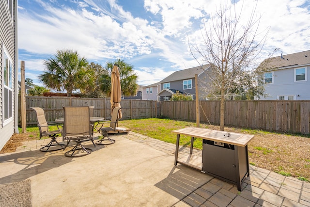 view of patio featuring outdoor dining area and a fenced backyard