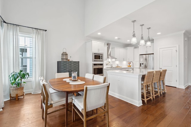 dining room with sink and dark wood-type flooring