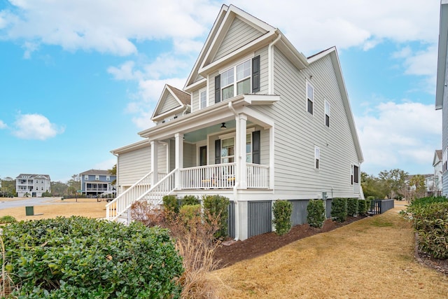 view of front facade with a front lawn and a porch