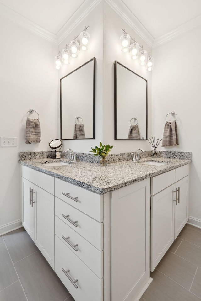 bathroom featuring tile patterned flooring, vanity, and ornamental molding