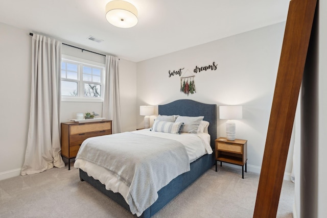 bedroom with light colored carpet