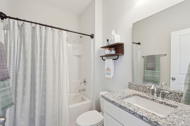 full bathroom featuring shower / tub combo with curtain, vanity, and toilet