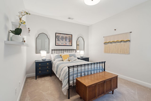 bedroom featuring light colored carpet