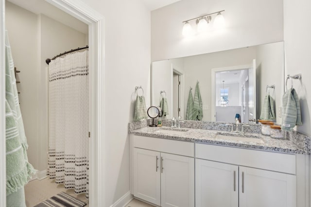 bathroom featuring vanity and walk in shower