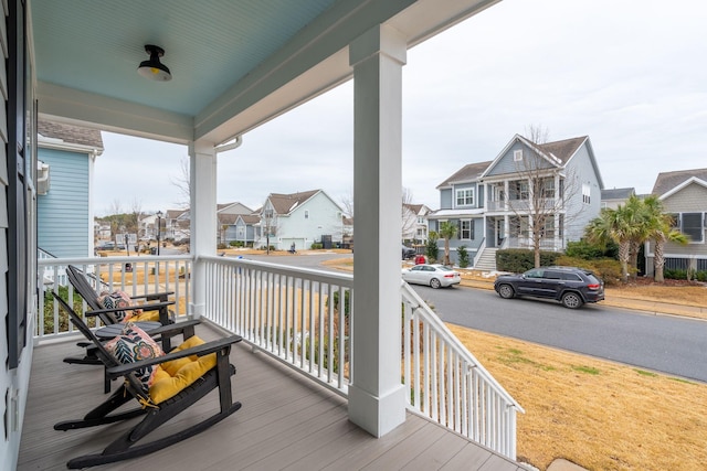 wooden deck featuring covered porch