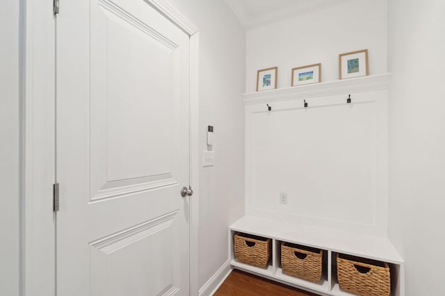 mudroom featuring ornamental molding and dark hardwood / wood-style floors