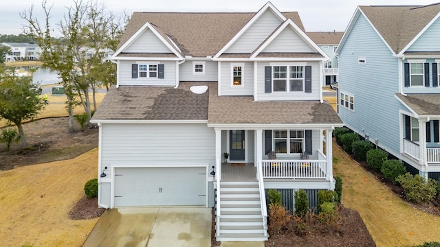 view of front of house with a garage and covered porch