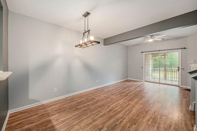 interior space with hardwood / wood-style floors and ceiling fan