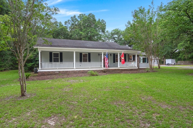 ranch-style home with a porch and a front yard