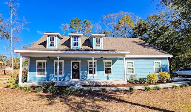 view of front of property with ceiling fan and covered porch