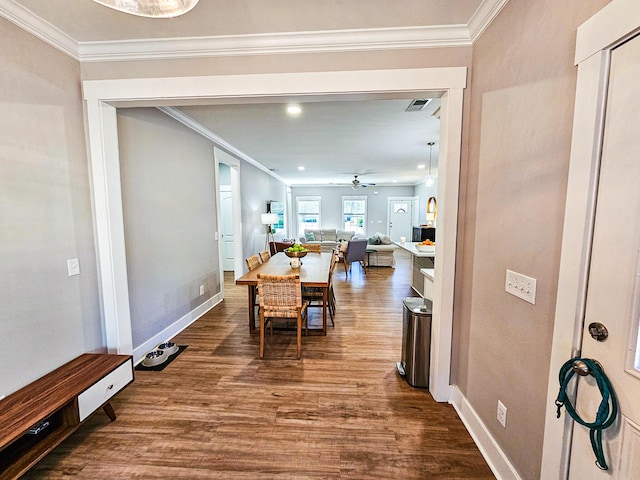 dining room featuring ceiling fan, ornamental molding, and hardwood / wood-style floors