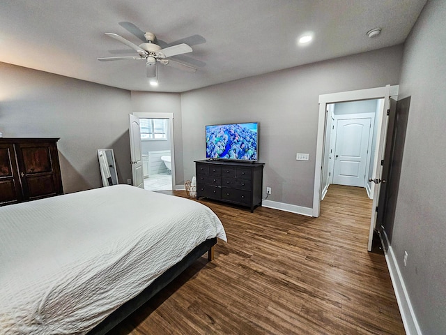 bedroom with ceiling fan, dark hardwood / wood-style flooring, and ensuite bathroom