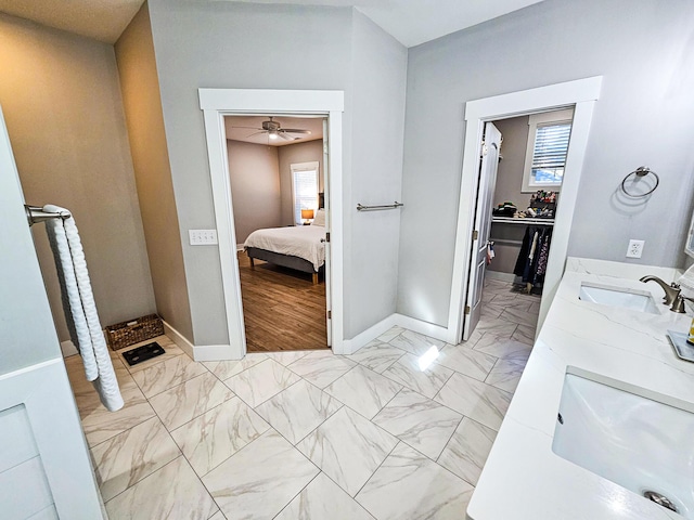 bathroom featuring ceiling fan and vanity