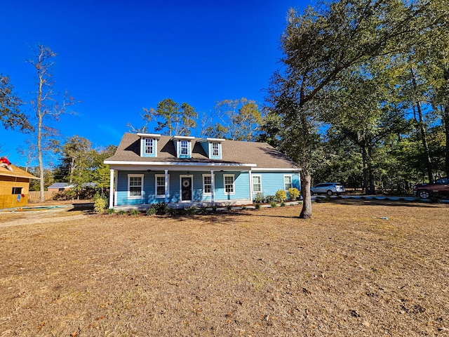 cape cod-style house with a porch