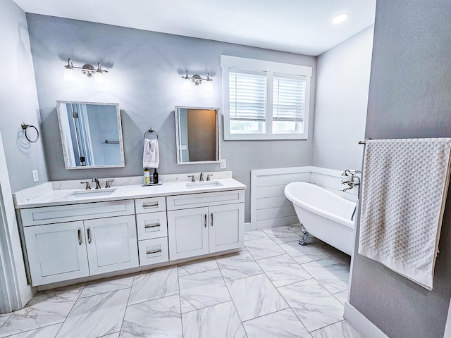 bathroom with a tub and vanity