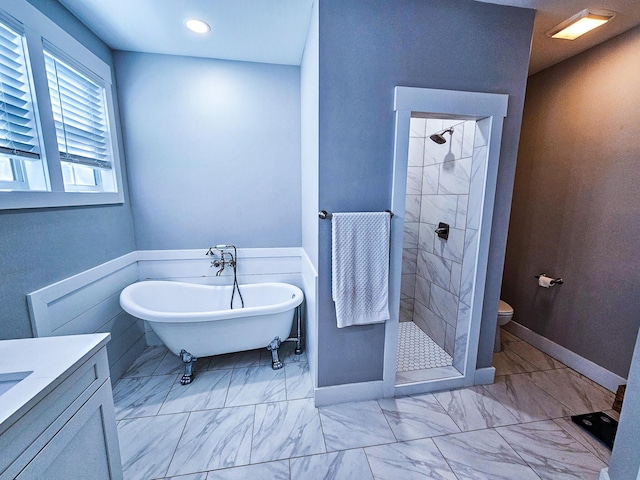 full bathroom featuring toilet, vanity, and shower with separate bathtub