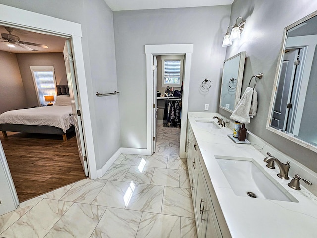 bathroom featuring ceiling fan and vanity